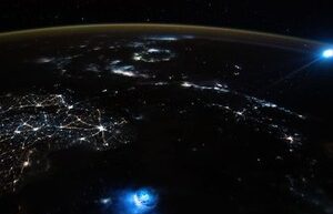 An ISS astronaut took a picture of the Earth with unusual blue flashes in the atmosphere: what is it